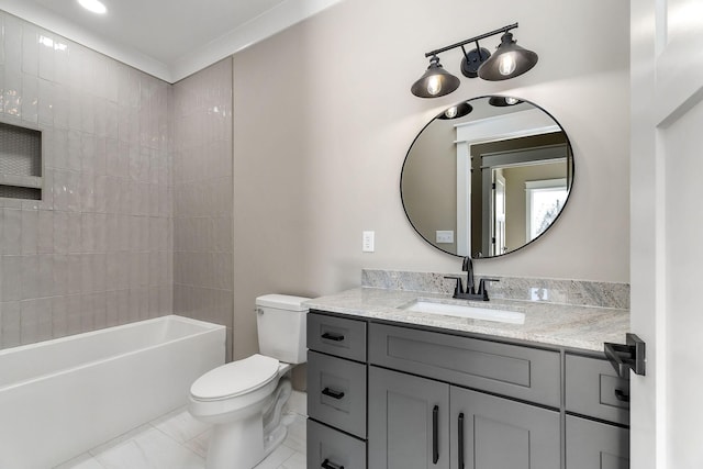 full bathroom with vanity, tiled shower / bath, and toilet