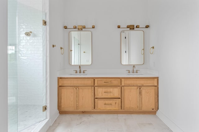 bathroom with vanity and a shower with door