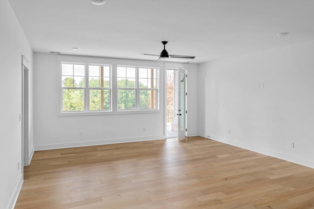 unfurnished room featuring ceiling fan and light hardwood / wood-style flooring