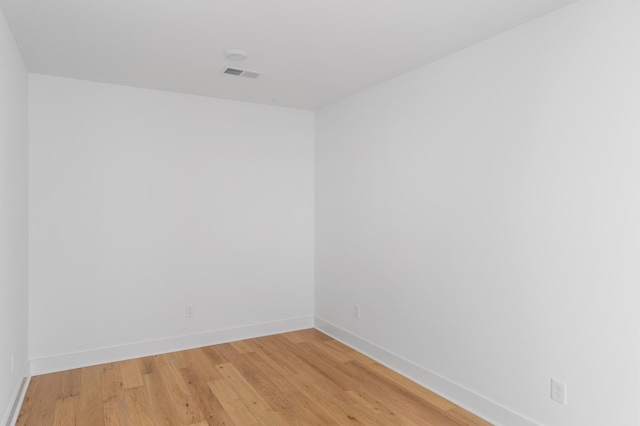 empty room with wood-type flooring