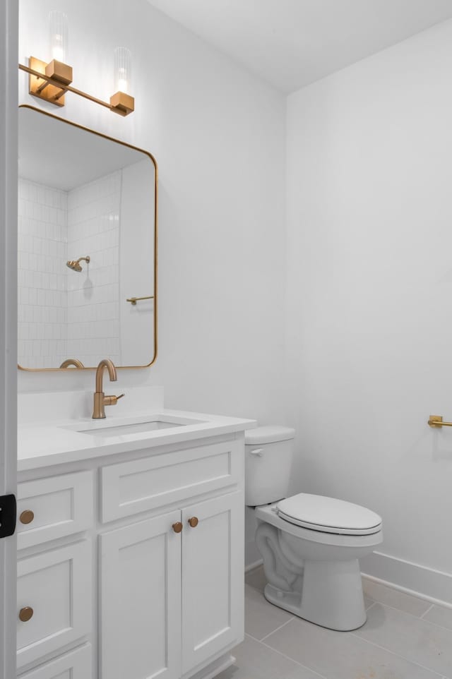 bathroom with vanity, a shower, tile patterned floors, and toilet