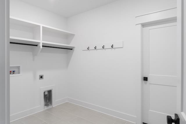 washroom with light tile patterned floors, hookup for a washing machine, and electric dryer hookup