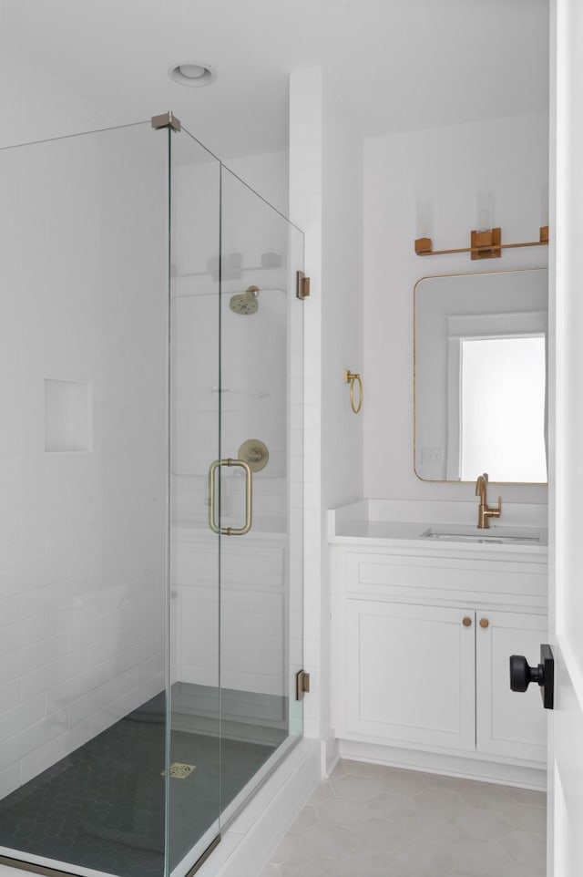 bathroom with vanity and walk in shower