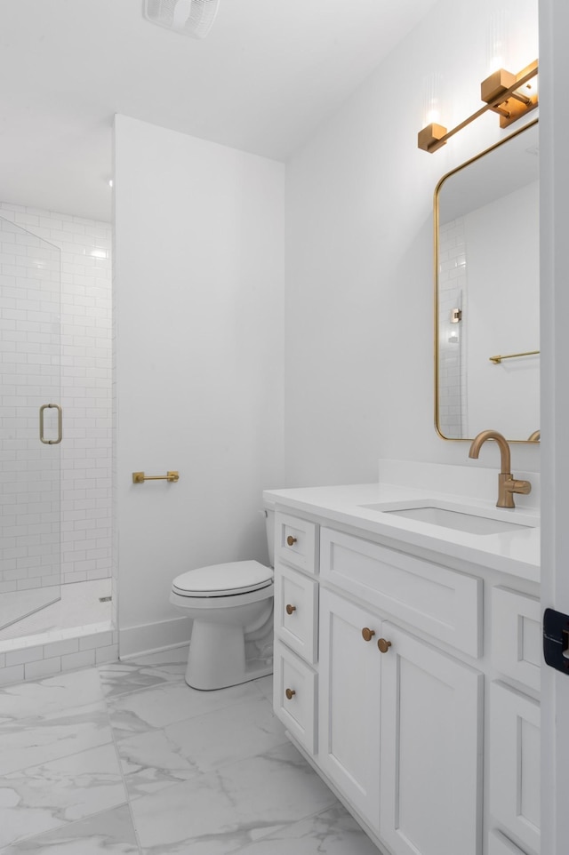 bathroom with vanity, toilet, and walk in shower