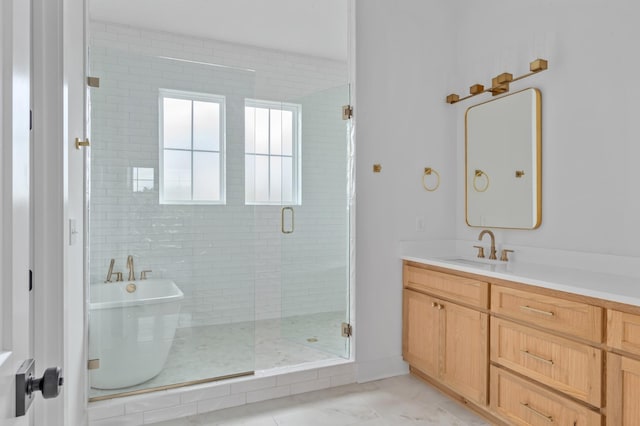 bathroom featuring vanity and separate shower and tub