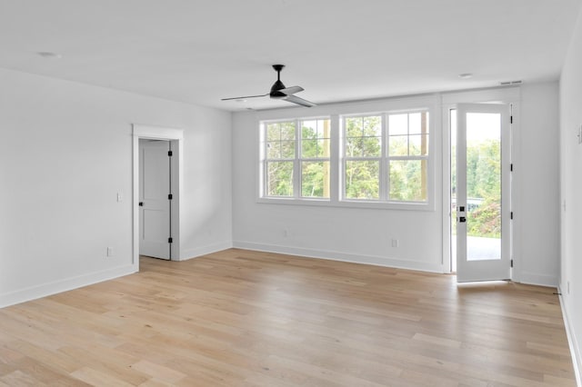 empty room featuring ceiling fan and light wood-type flooring