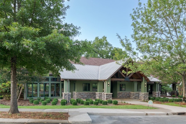 view of front of home with a sunroom