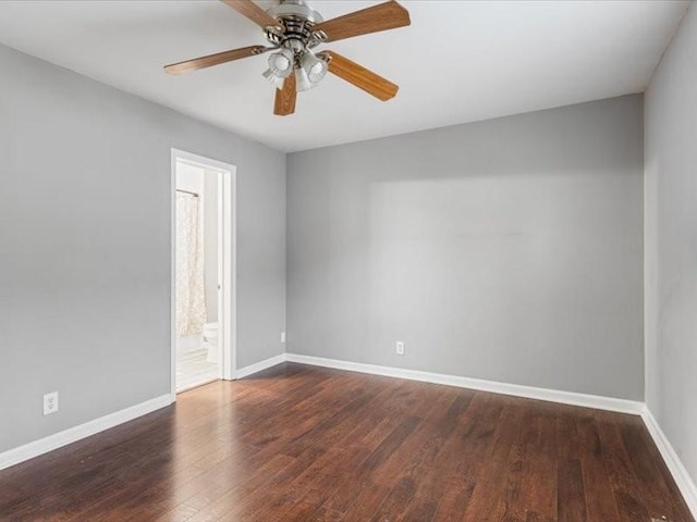 unfurnished room with ceiling fan and dark hardwood / wood-style flooring