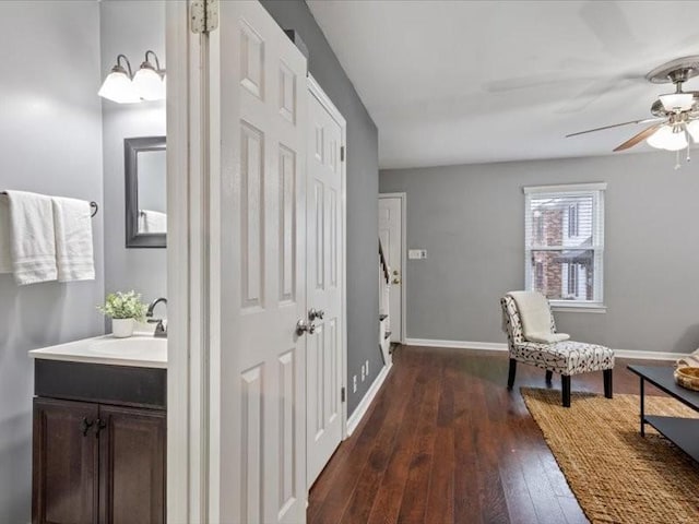 corridor with sink and dark hardwood / wood-style floors