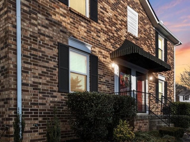 view of property exterior at dusk