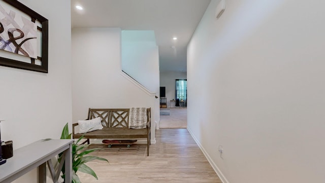 corridor with light wood-type flooring