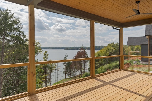 wooden terrace with ceiling fan and a water view