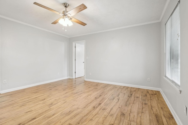 spare room with ornamental molding, light hardwood / wood-style floors, and ceiling fan