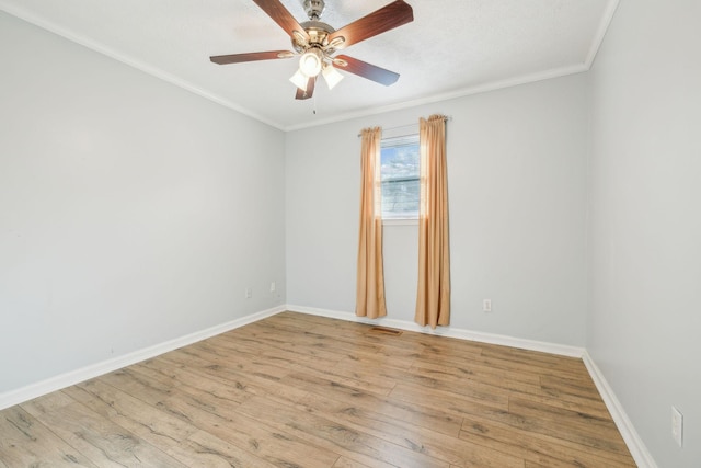 spare room featuring ornamental molding, light hardwood / wood-style floors, and ceiling fan