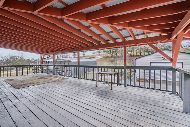 wooden terrace with a shed