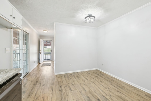 unfurnished dining area featuring crown molding, a textured ceiling, and light wood-type flooring