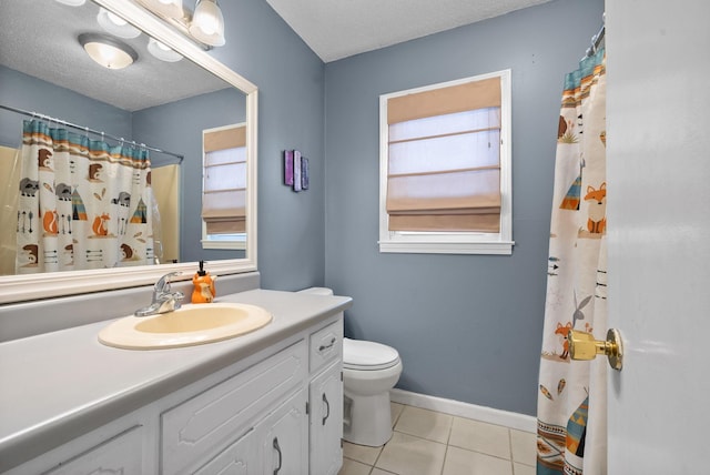 bathroom featuring vanity, a textured ceiling, tile patterned floors, and toilet