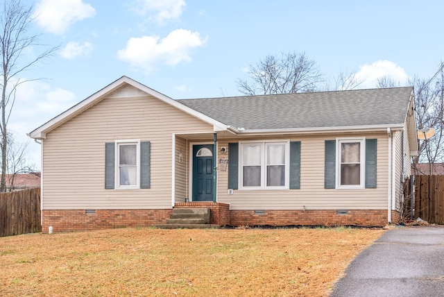 single story home featuring a front lawn