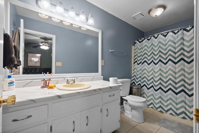 bathroom featuring ceiling fan, vanity, curtained shower, tile patterned floors, and toilet