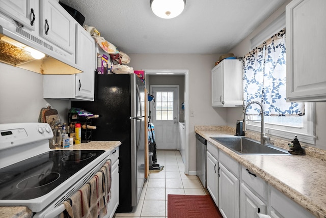 kitchen featuring light tile patterned flooring, white electric stove, sink, white cabinets, and stainless steel dishwasher