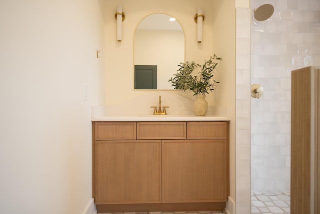 bathroom featuring vanity and a tile shower