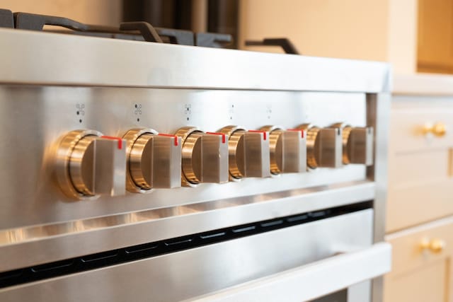 interior details featuring high end stainless steel range oven