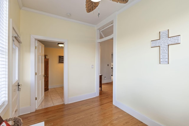 interior space featuring ornamental molding and light hardwood / wood-style floors