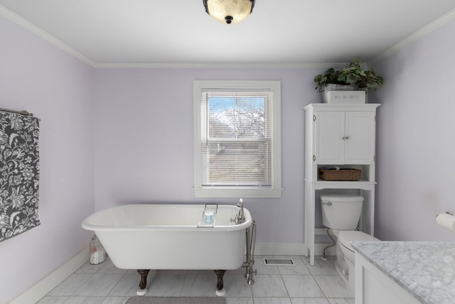 bathroom with crown molding, a tub, vanity, and toilet