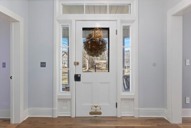 foyer with wood-type flooring