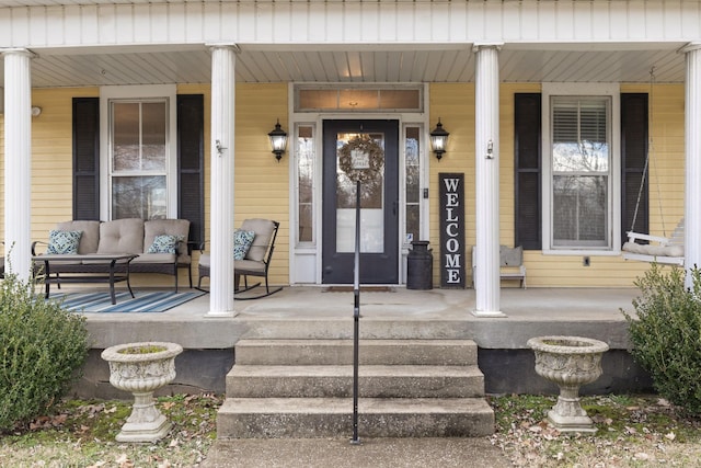 doorway to property with a porch