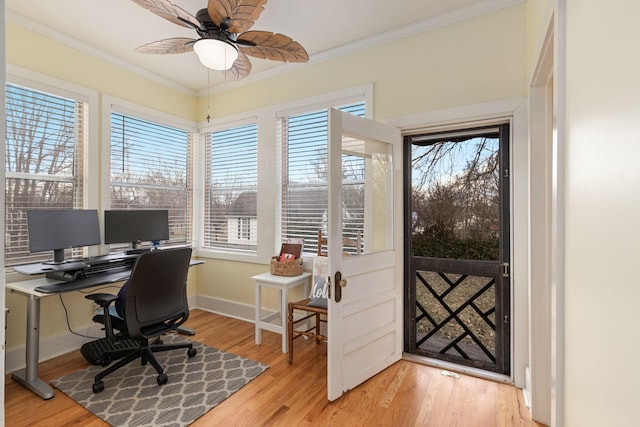 office space with crown molding, ceiling fan, and light hardwood / wood-style floors