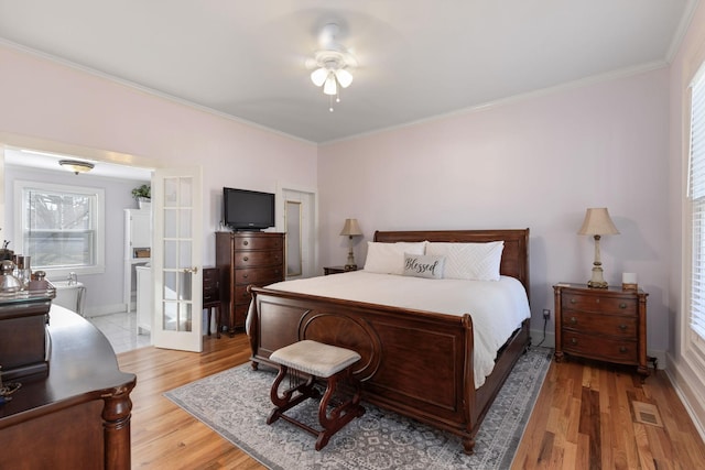 bedroom featuring french doors, crown molding, ceiling fan, and light hardwood / wood-style flooring