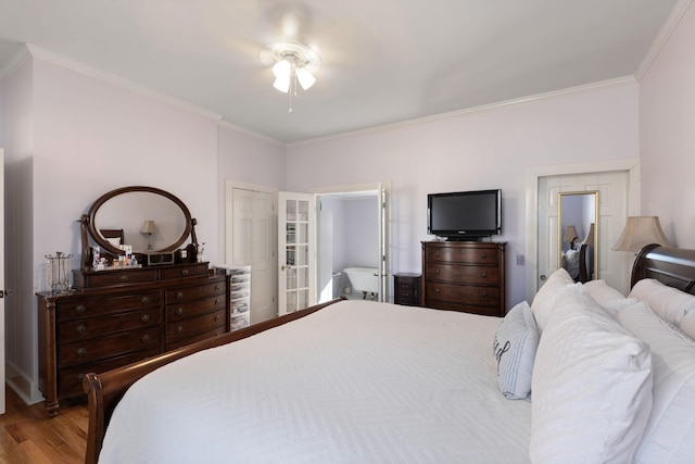 bedroom with crown molding, ceiling fan, and light wood-type flooring