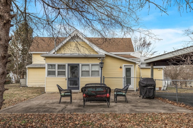 back of property featuring outdoor lounge area and a patio