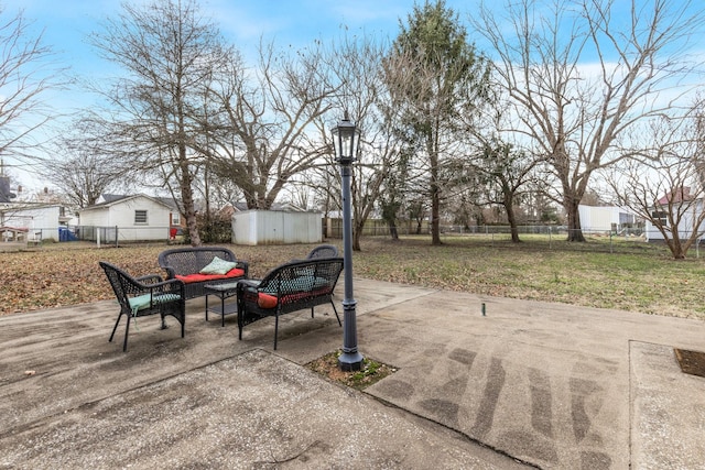 view of patio featuring a shed and an outdoor hangout area