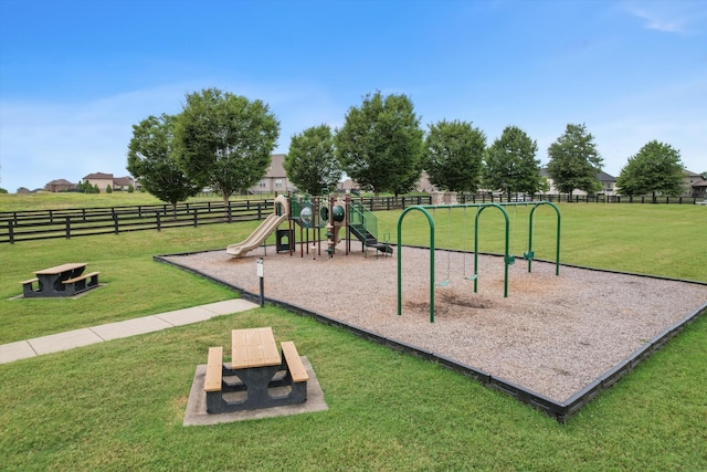 view of playground featuring a lawn