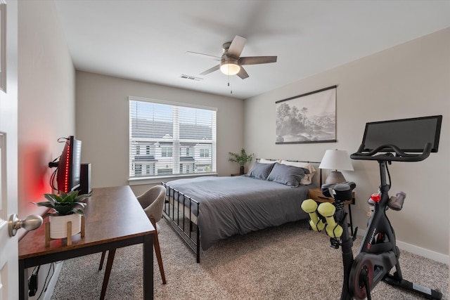 bedroom featuring light colored carpet and ceiling fan