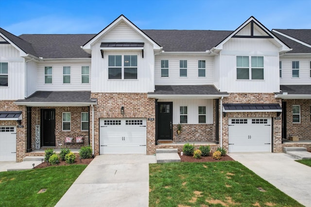 townhome / multi-family property featuring a garage and a front yard