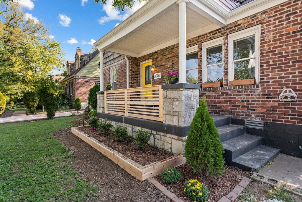 property entrance featuring covered porch