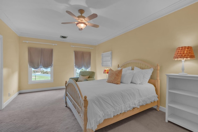 carpeted bedroom with ceiling fan and ornamental molding