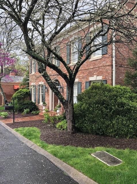 exterior space featuring brick siding