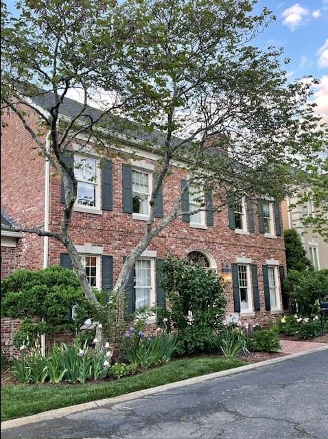 view of front of home featuring brick siding