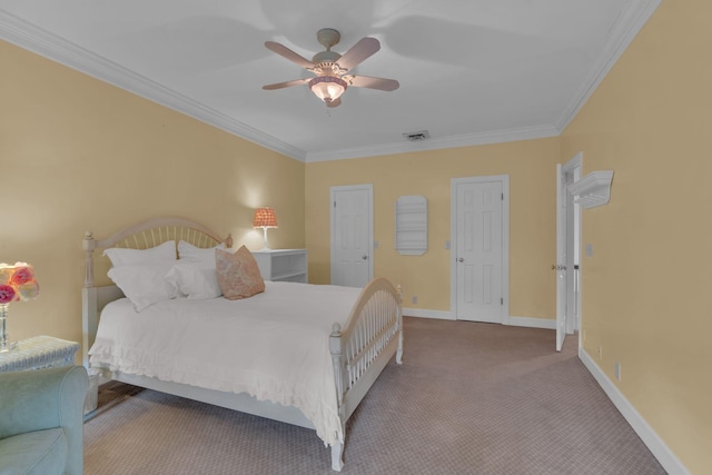 carpeted bedroom featuring crown molding and ceiling fan