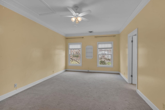 unfurnished room with a ceiling fan, baseboards, crown molding, and light colored carpet