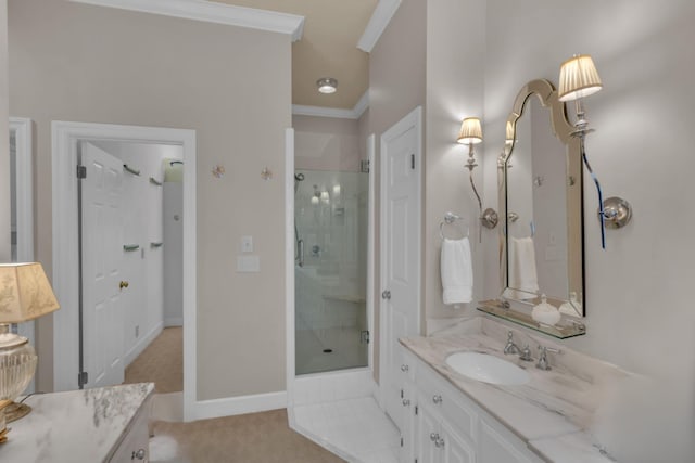 bathroom featuring ornamental molding, a stall shower, and vanity