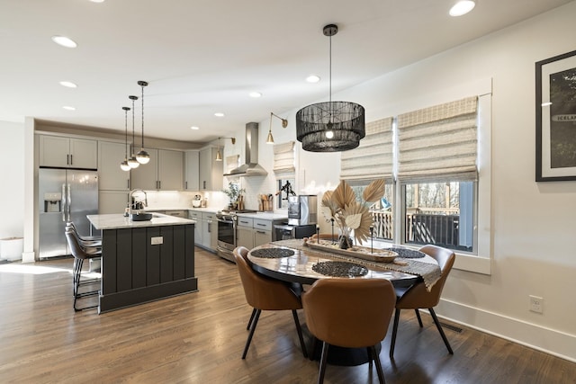 dining space with sink and dark hardwood / wood-style floors