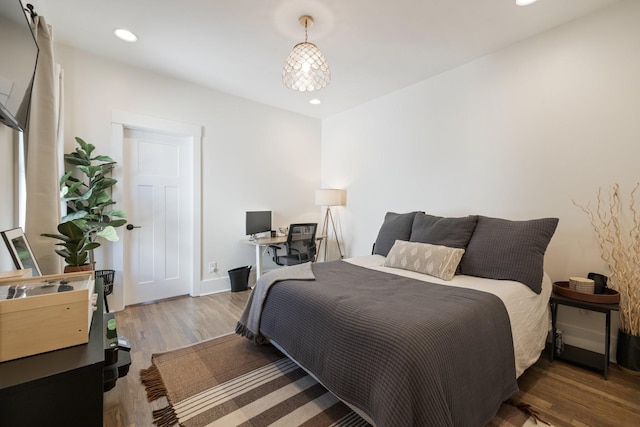 bedroom with wood-type flooring