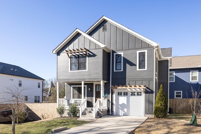 view of front of property with a garage and a porch