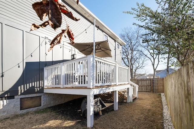 view of property exterior featuring a wooden deck