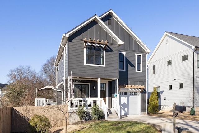 view of front of property featuring a garage and a porch